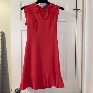 Coral knee length dress with ruffle details
